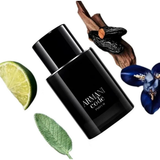 Black Armani Code perfume bottle with lime, leaf, and flower on a white background