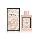 Gucci Bloom perfume bottle and packaging on a white background