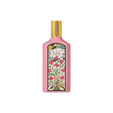 Gucci Flora perfume bottle with floral design on a white background