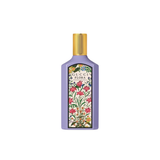 Gucci Flora perfume bottle with floral design on a white background