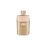 Gold Gucci perfume bottle on a white background