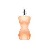 Perfume bottle with a peach-colored body and silver cap on a white background