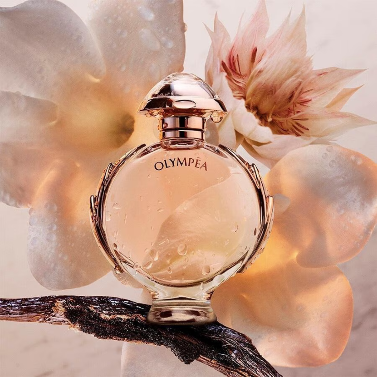 Perfume bottle labeled 'Olympea' with floral background