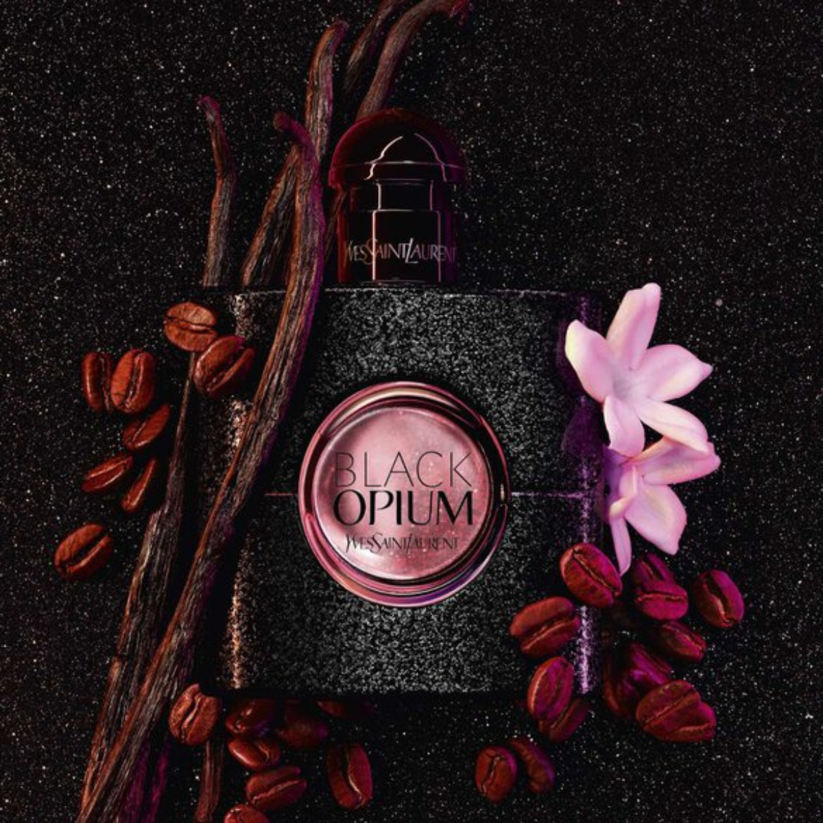 YSL Black Opium perfume bottle with coffee beans and flowers on a dark background